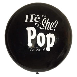Gender Reveal balloon prop with "He or She? Pop to See! printed on it.