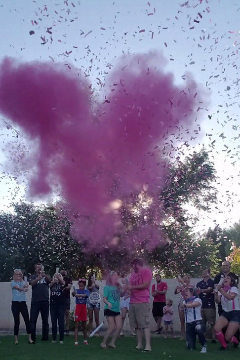 The parents to be were amazed by our pink gender reveal and powder cannon that was popped high above their heads