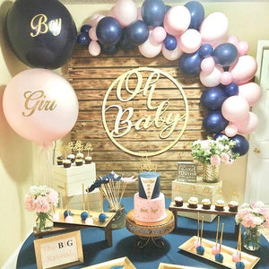 Gender Reveal dessert table with boy and girl themed treats.