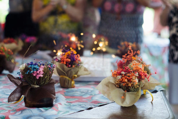 Gender reveal floral props on a table.