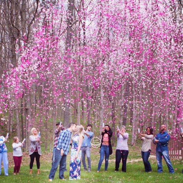 Friends and Family douse the parents to be with a huge amount of our pink confetti cannons 